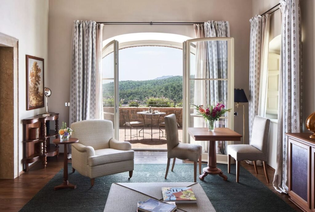 Luxurious guest suite at Rosewood Castiglion del Bosco with rustic-chic interiors and modern amenities.