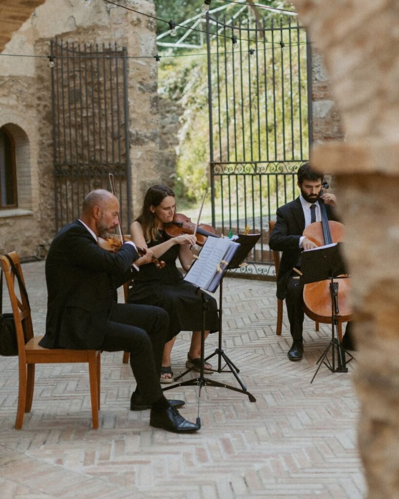 Elegant string quartet playing live music during a wedding ceremony at Antico Convento.