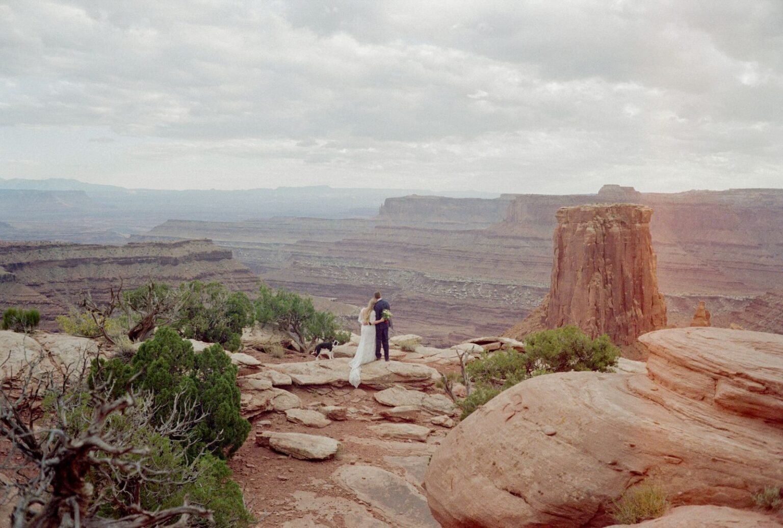 Wedding altar with stunning mountain backdrop at Whispering Oaks Ranch, shot by Kayla Bertagnolli.
