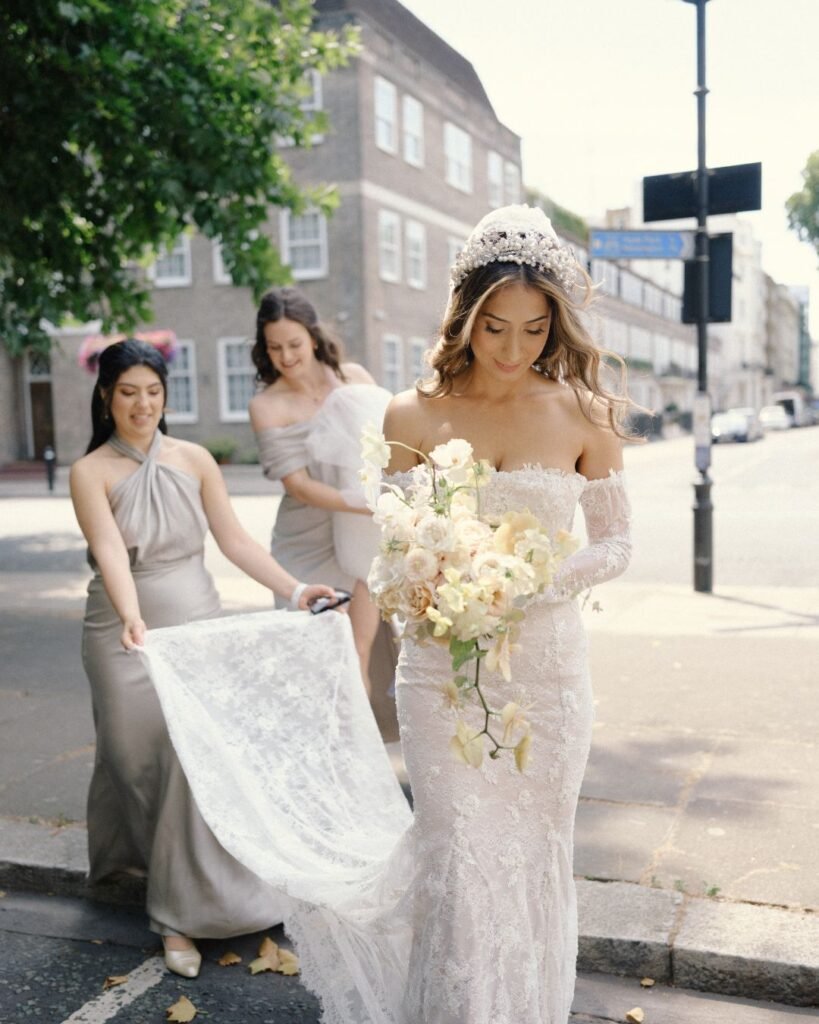 Bride walking down the aisle, guests smiling as she approaches the altar.