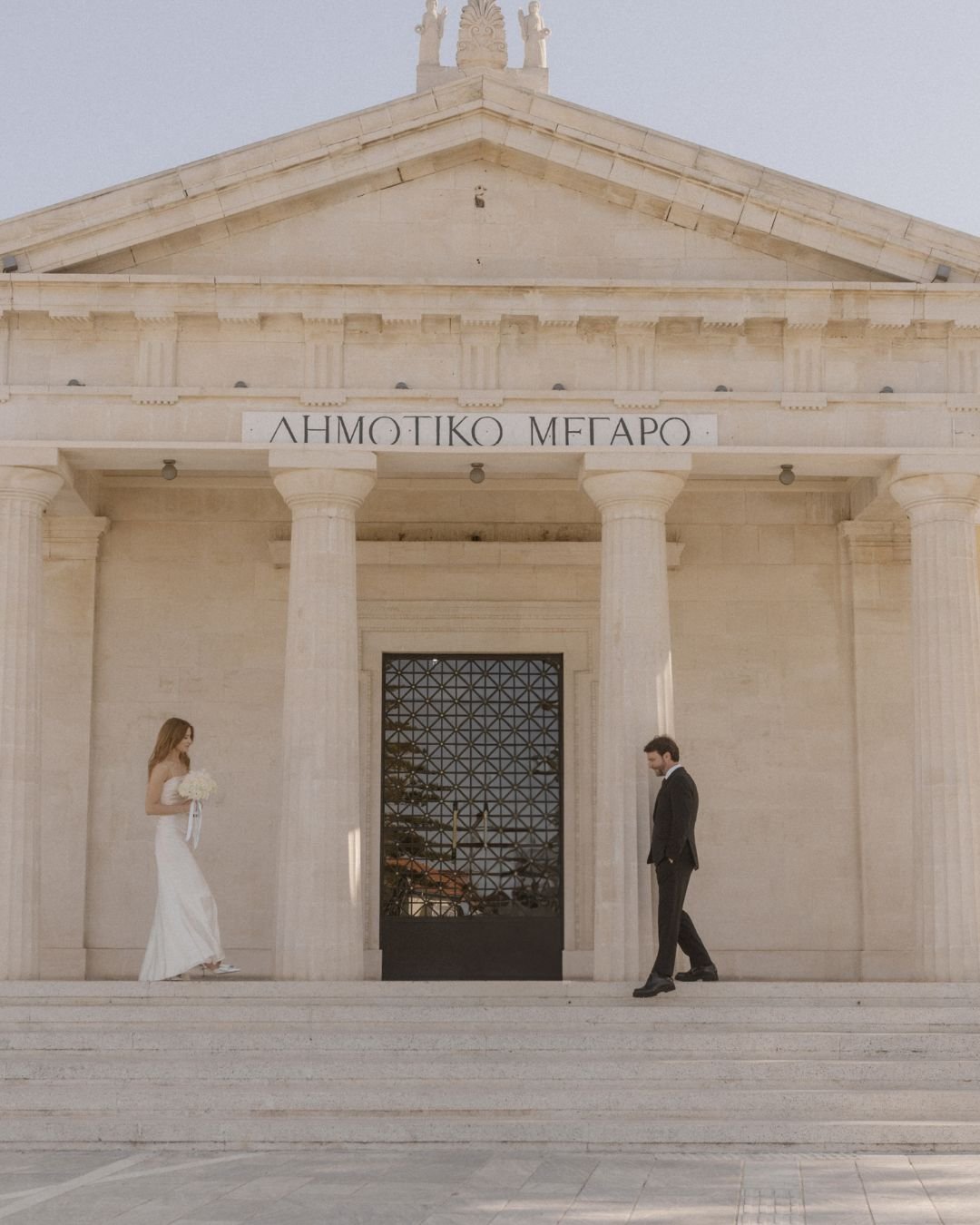 A couple embraces on a cliffside, overlooking the vast Mediterranean Sea in Cyprus, captured by Karina Leonenko.