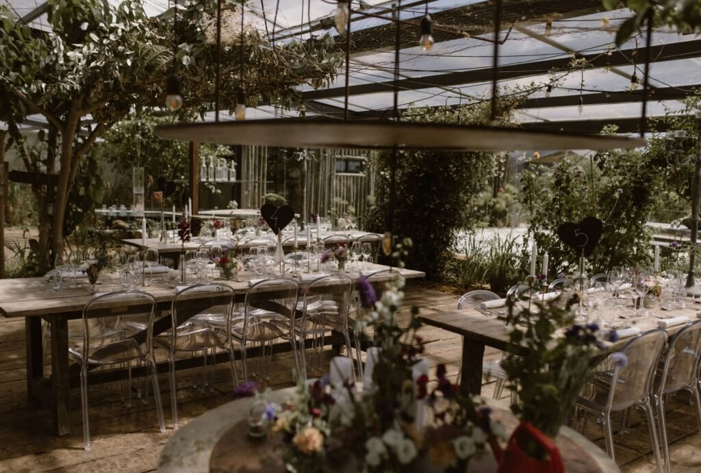 A reception table setup at Areias do Seixo, styled with elegant linens, soft candlelight, and natural floral arrangements.