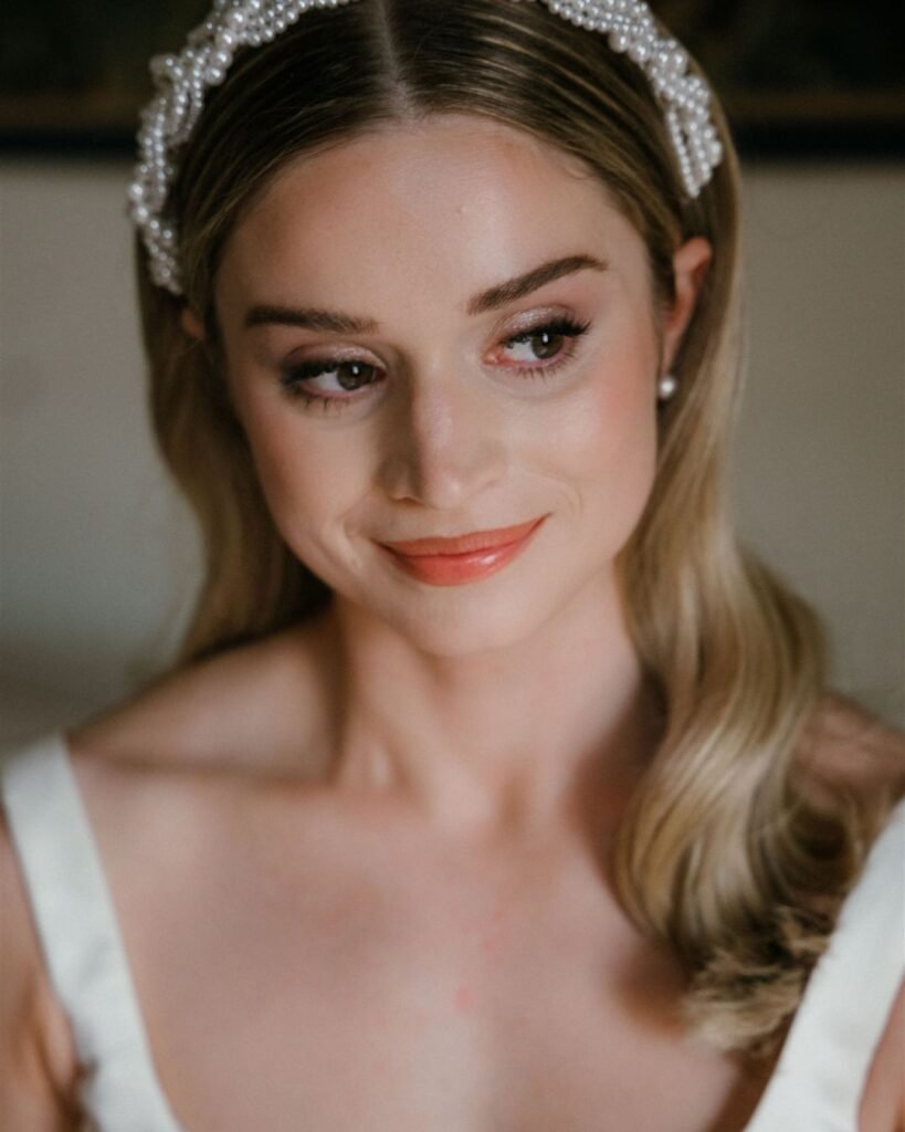 A soft and intimate close-up of the bride, sunlight filtering through the villa's windows at Rosewood Castiglion del Bosco.
