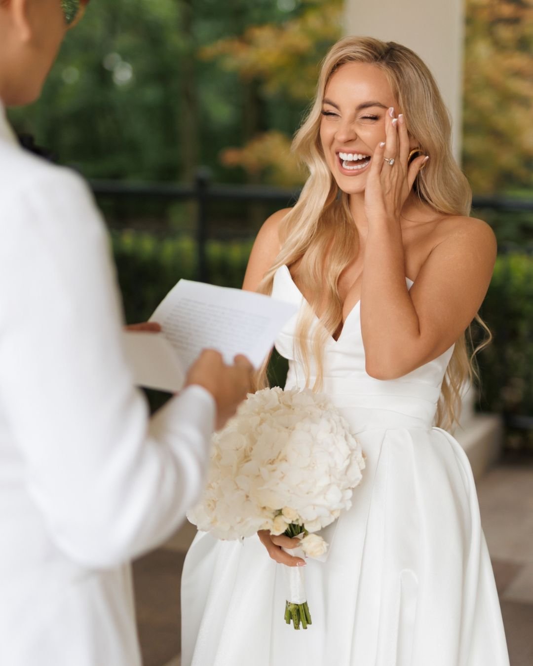 Bride joyfully reacts during emotional wedding vows, captured candidly by Sylwia Zylka.