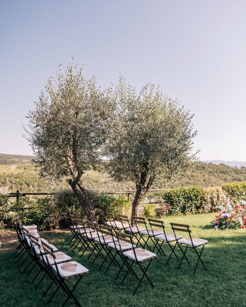Rows of ceremony chairs facing a stunning countryside backdrop at Quercia al Poggio.
