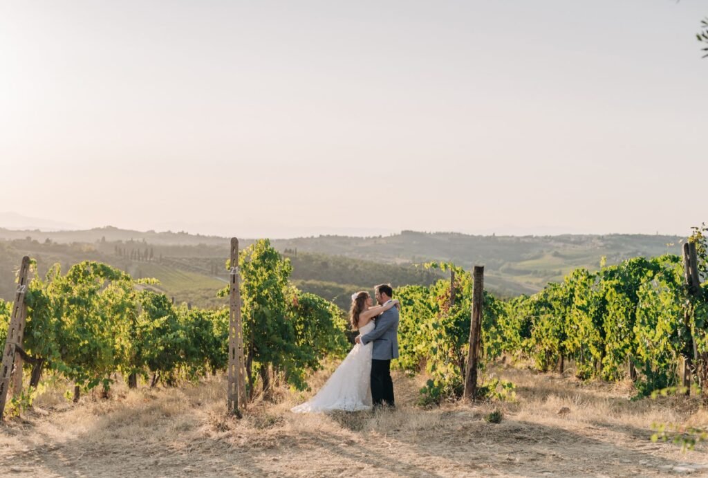 The newlyweds share a quiet moment walking through the lush vineyards of Quercia al Poggio.