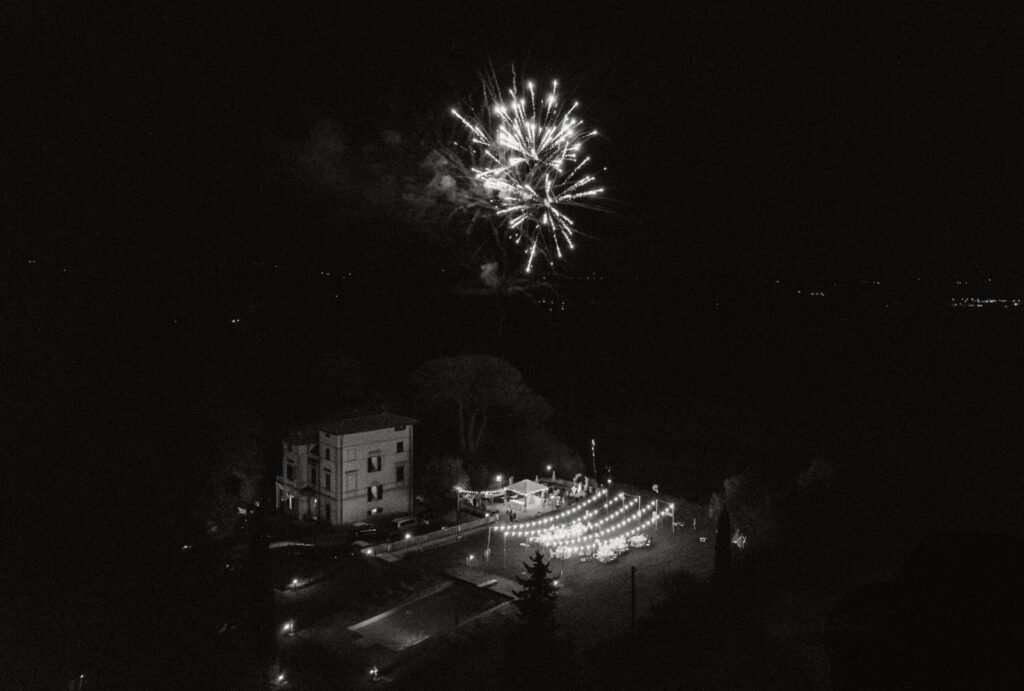 Fireworks light up the night sky above Villa Donna Camilla, creating a magical wedding moment.