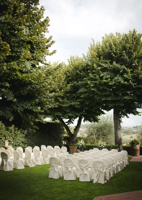 Peaceful ceremony garden with views of the Tuscan hills at Borgo Tre Rose.