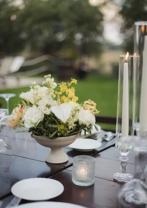 Close-up of cream and yellow wedding centerpiece at Borgo Tre Rose