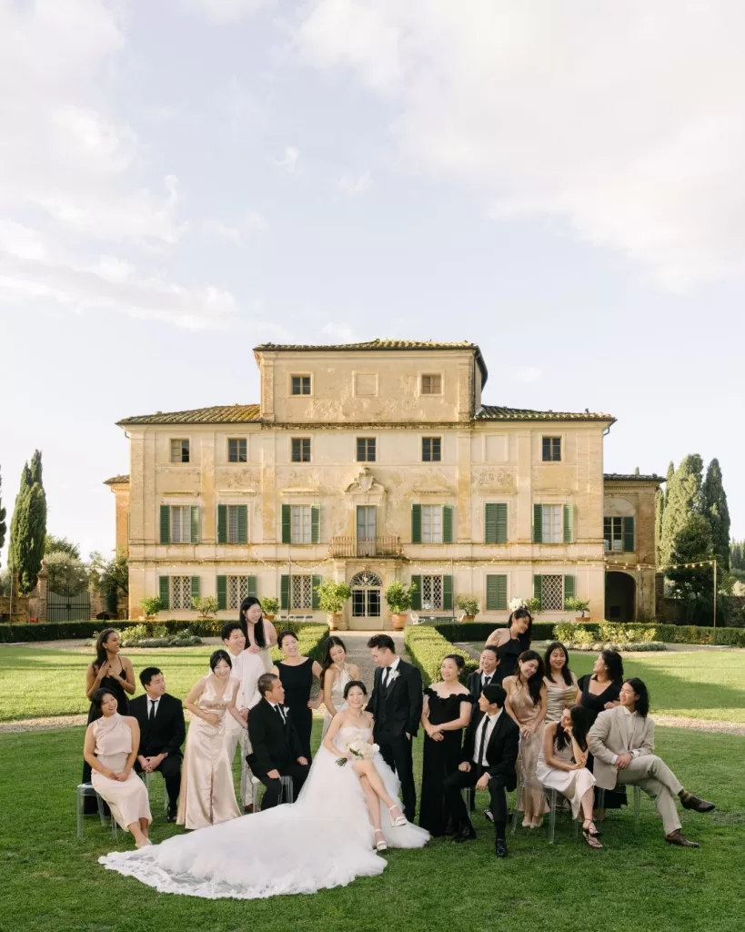 The newlyweds laugh and celebrate with guests, capturing the joy of the wedding day.