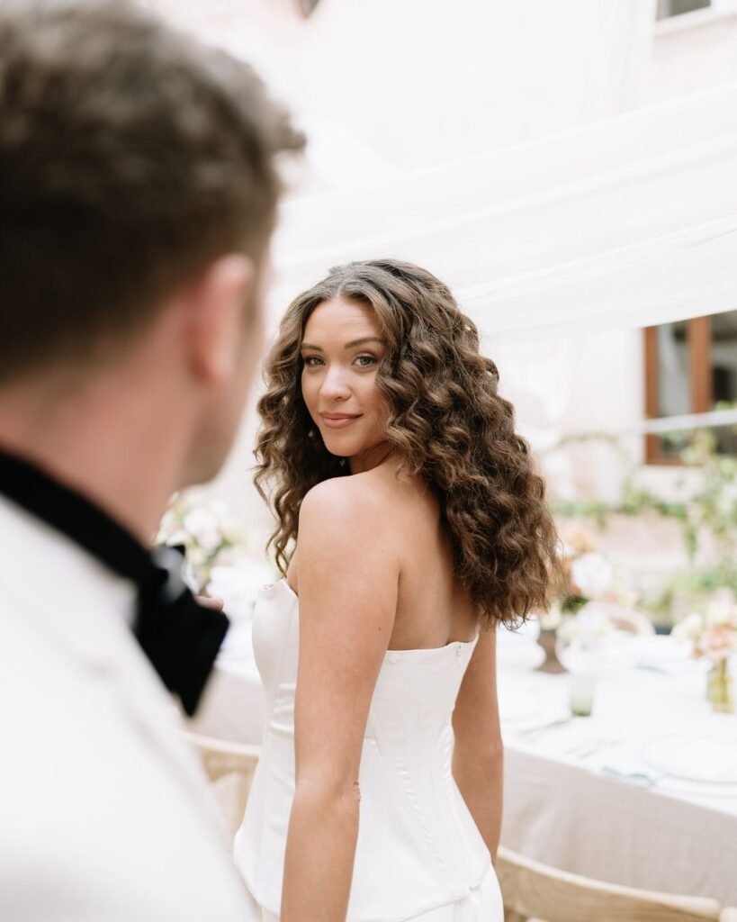 Bride exchanging an affectionate, romantic glance with groom during their wedding celebration at Finca Morneta.