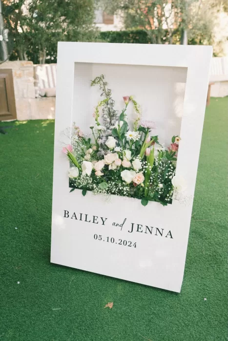 Floral wedding welcome sign for Bailey and Jenna's Liopetro celebration.