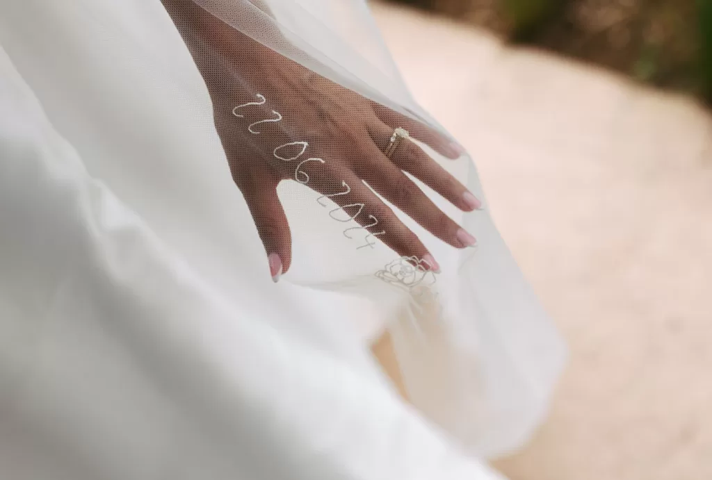 Wedding date embroidered on bride’s veil with ring detail at Mas Torroella