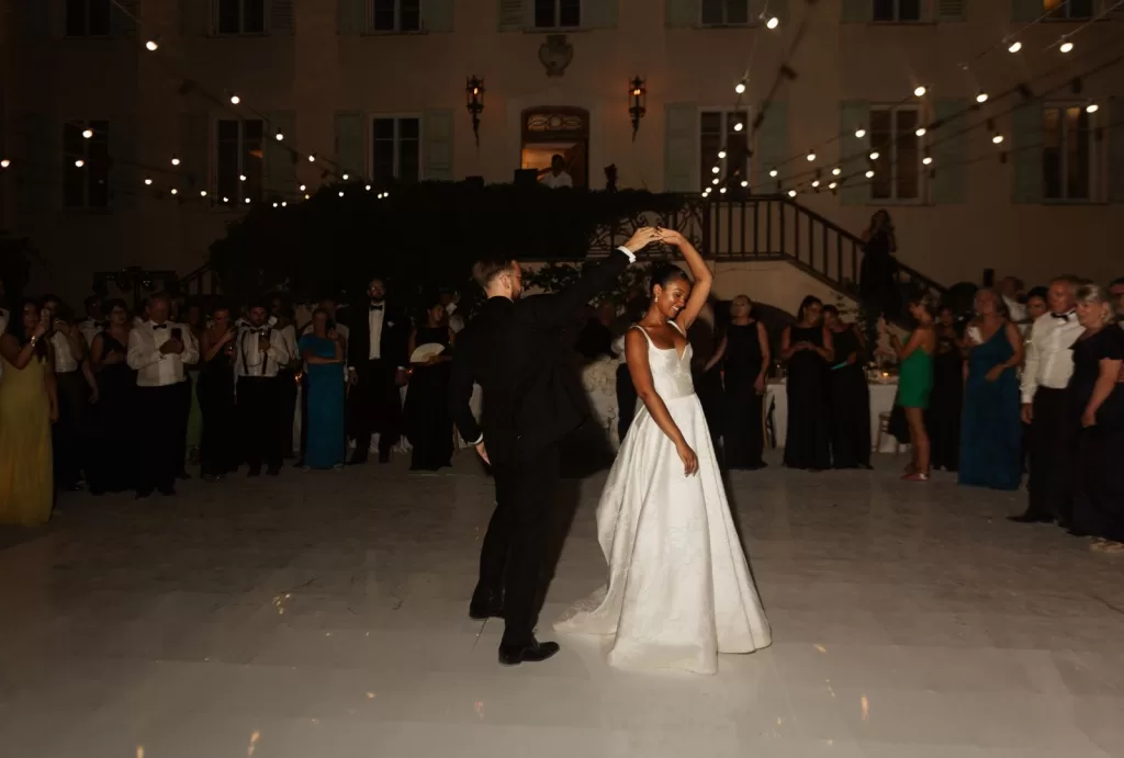 Romantic first dance moment for the couple at Bastide du Roy, with twinkling lights illuminating the night.