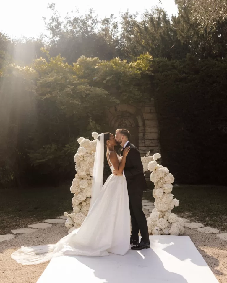 Bride and groom share a quiet, intimate moment in the gardens of Bastide du Roy, surrounded by nature