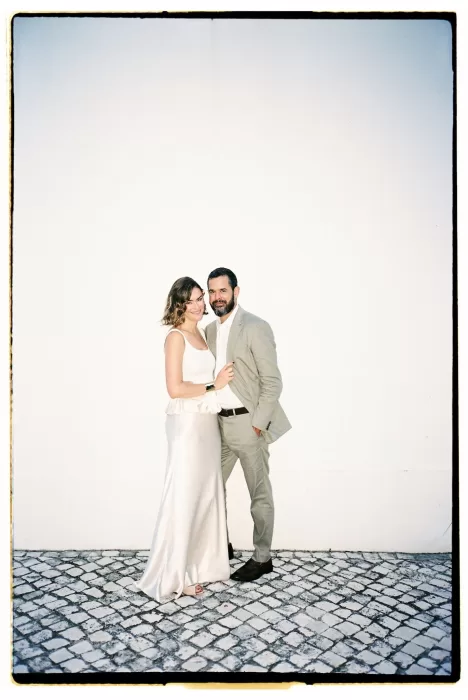 Romantic bride and groom portrait in front of Casa Sacoto’s whitewashed wall
