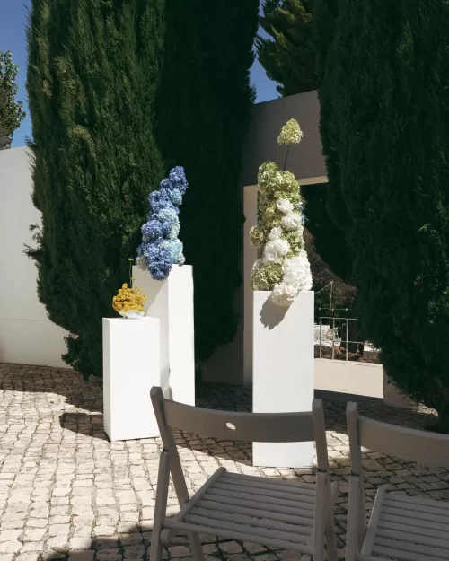 Wedding ceremony setup with modern plinths and neutral chairs at Casa Sacoto