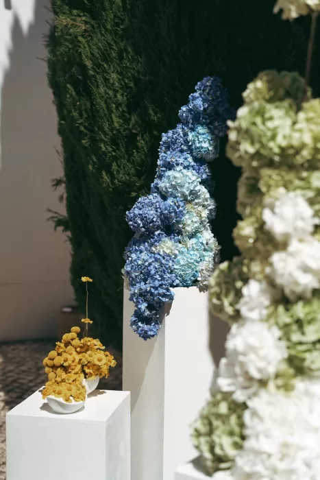 Floral pillars framing the wedding altar at Casa Sacoto