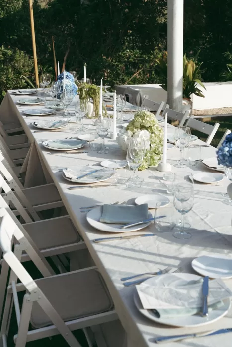 Stylish tablescape with candles and florals for an al fresco reception at Casa Sacoto
