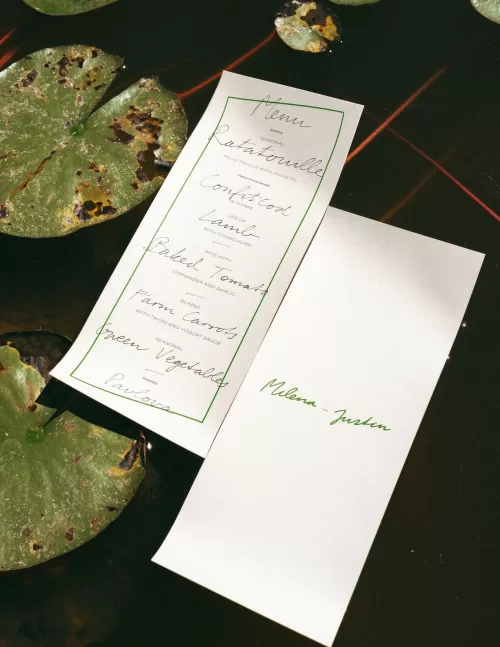 Wedding menu styled near the pond with floral accents at Casa Sacoto