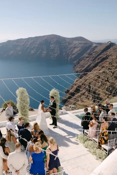 Wedding ceremony setup facing the Aegean Sea, with minimalist elegance at Rocabella Santorini