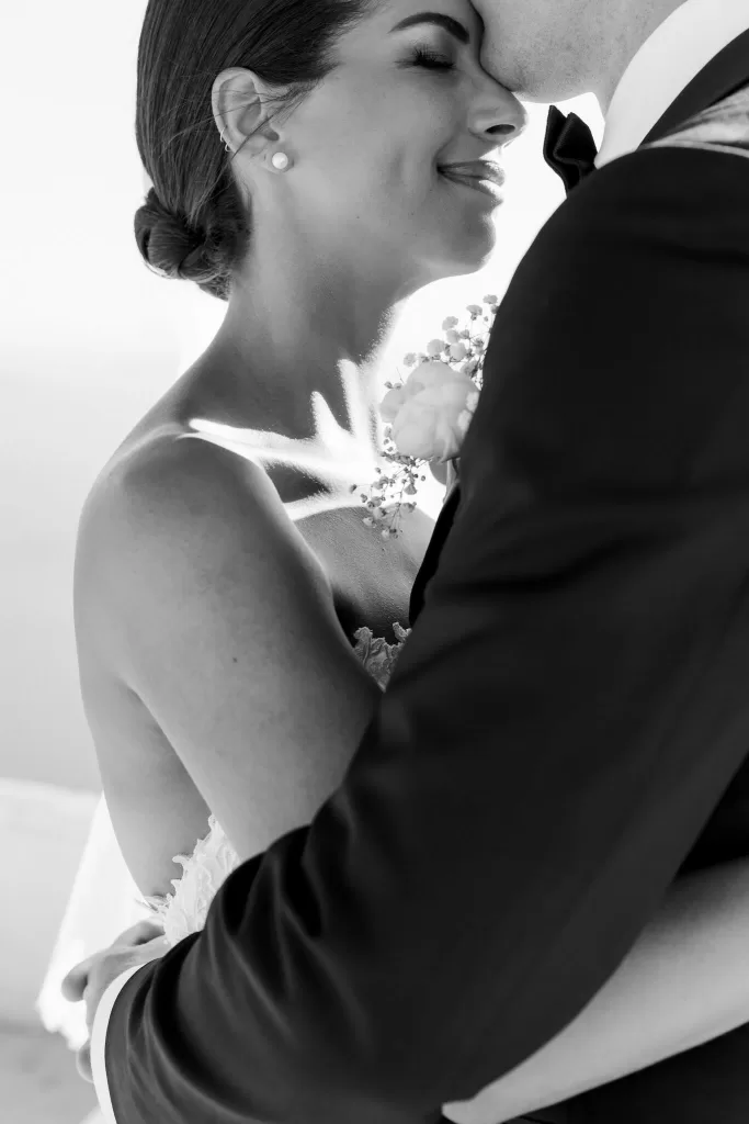 ender close-up of newlyweds sharing an intimate moment at Rocabella Santorini