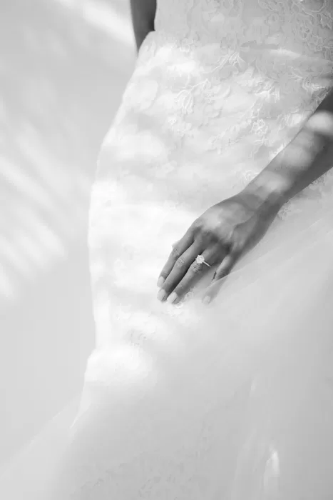 Close-up of engagement and wedding rings on soft textured fabric