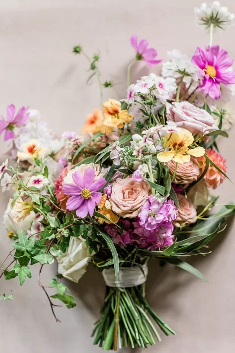 Romantic bridal bouquet with pastel and bright wildflowers styled for Monte Pacis wedding