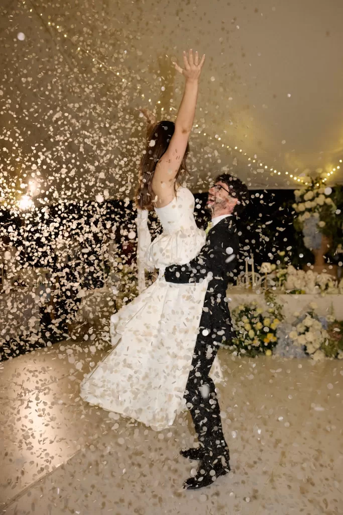 Bride lifted in the air as confetti falls during the first dance celebration at Le Mas Barossa.