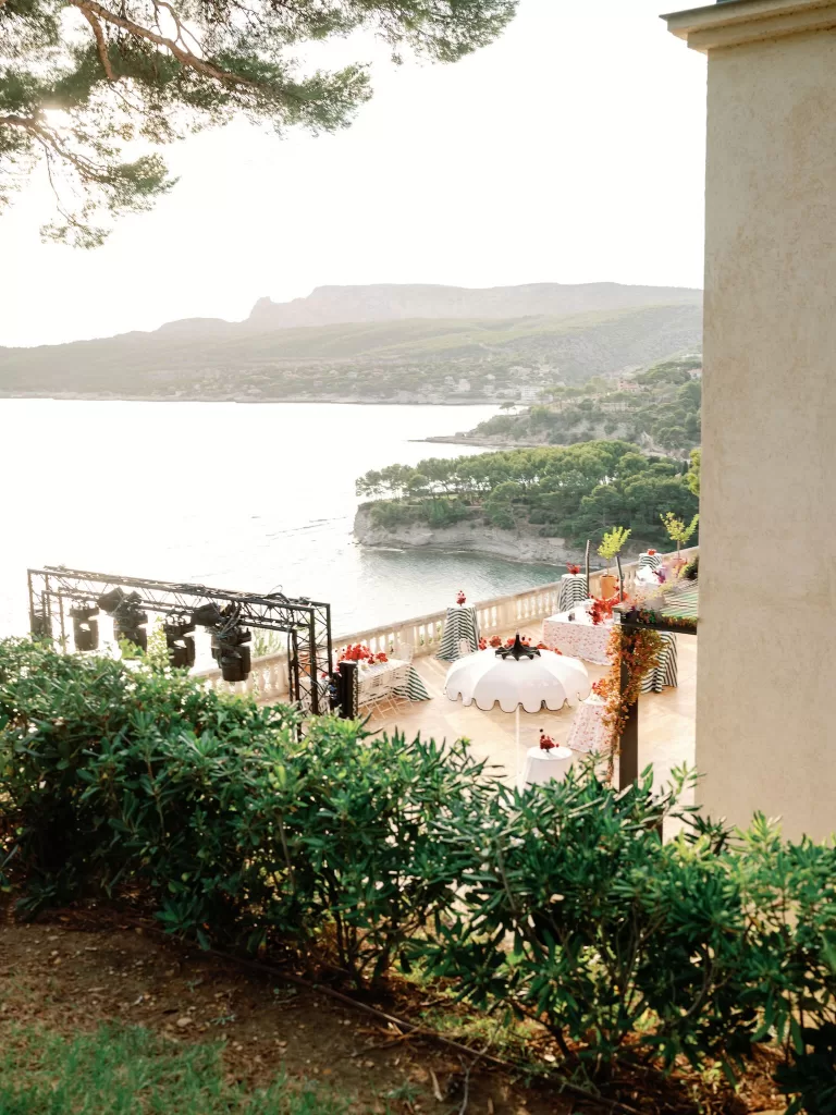 Evening reception setup on the terrace overlooking the Mediterranean at Domaine de Canaille