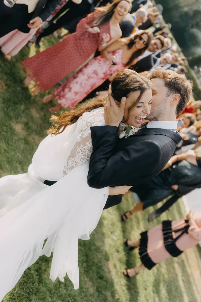 Joyful confetti moment as the newlyweds celebrate with guests on the lawns of Mas de Les Voltes.