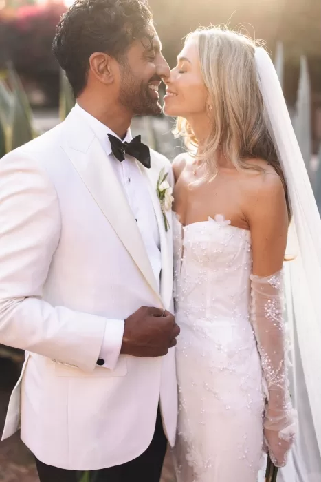 Bride and groom smiling closely in golden sunlight at Beldi Country Club, capturing a romantic wedding portrait