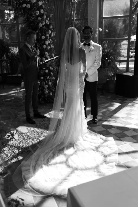 Bride and groom exchanging vows under natural light during ceremony at Beldi Country Club