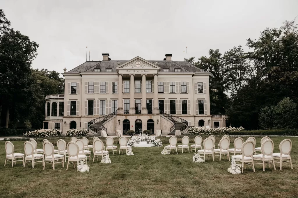 Elegant outdoor wedding ceremony setup on the lawn of Parc Broekhuizen.