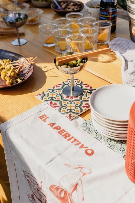 Aperitivo setup with olives, drinks, and Spanish-inspired decor during cocktail hour at This Must Be The Place.