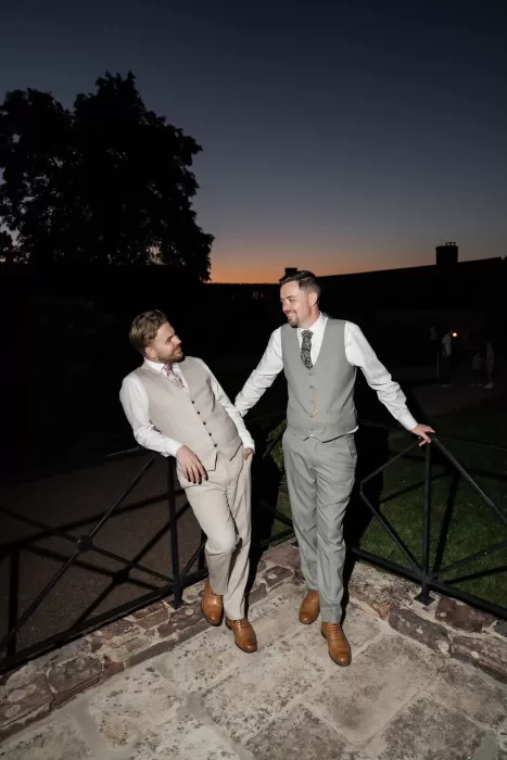 The couple enjoying the evening light together on the terrace of Château de Pordor at sunset.