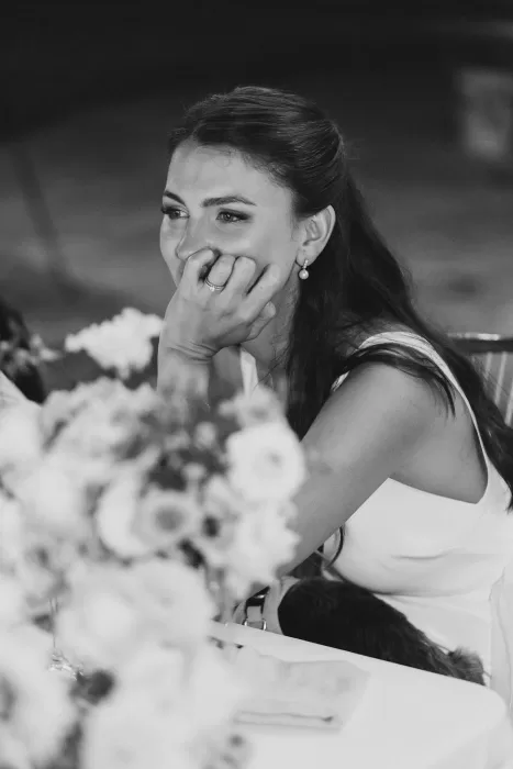 Emotional black-and-white moment of the bride smiling during the reception at Finca la Concepción.
