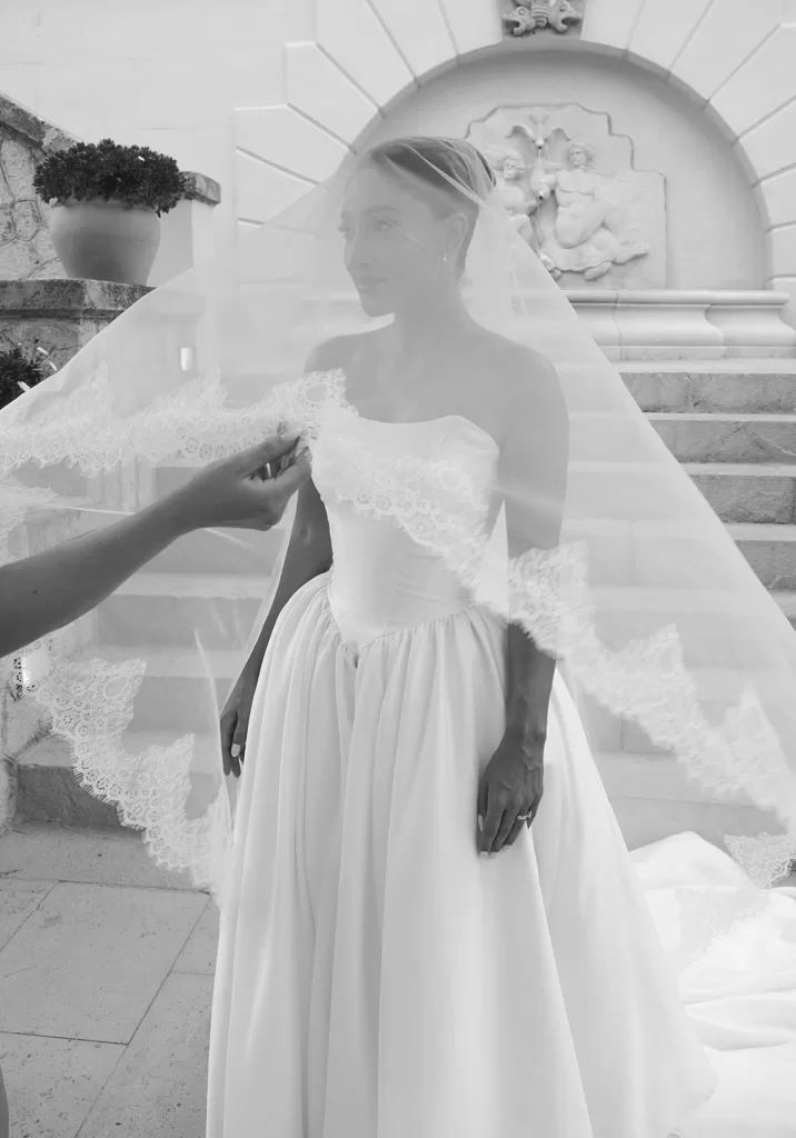 Bride stands gracefully beneath her lace veil in a timeless portrait at Hospes Maricel & Spa.