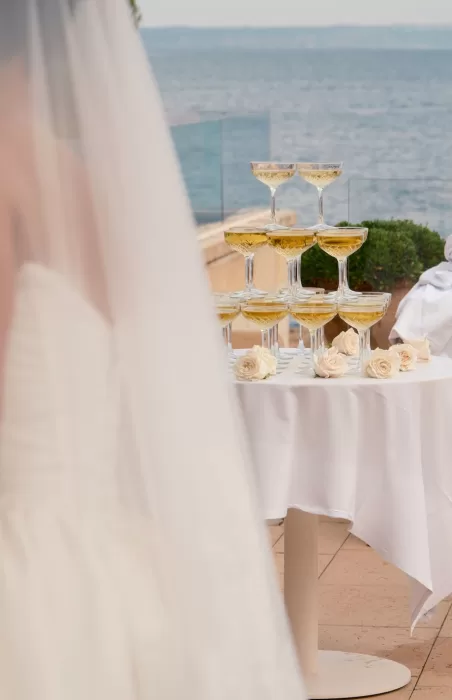 Elegant champagne tower set up on the terrace overlooking the sea at Hospes Maricel & Spa.