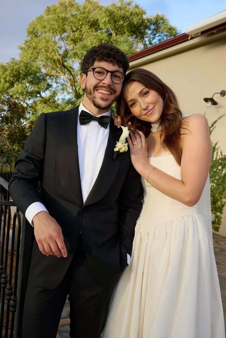 Bride resting her head on the groom’s shoulder during golden hour portraits at Le Mas Barossa.