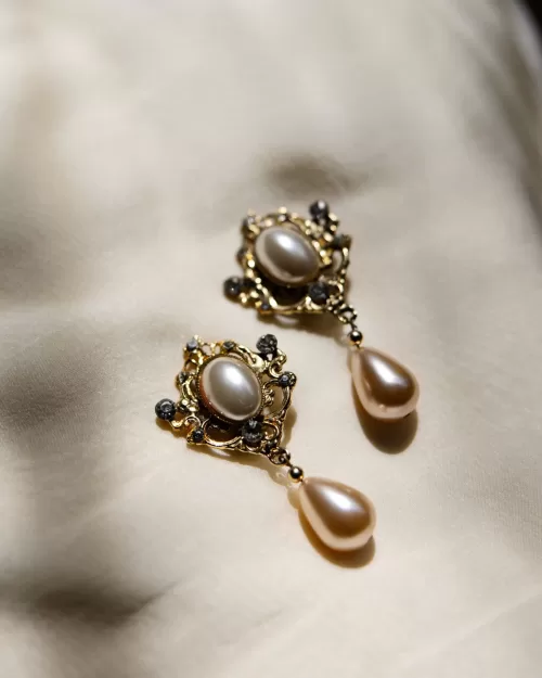 Elegant pearl drop bridal earrings photographed on fabric at Sergeants Mess wedding.
