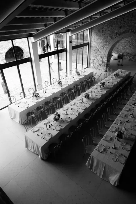 Black and white aerial view of the long banquet tables set for a wedding reception at This Must Be The Place.