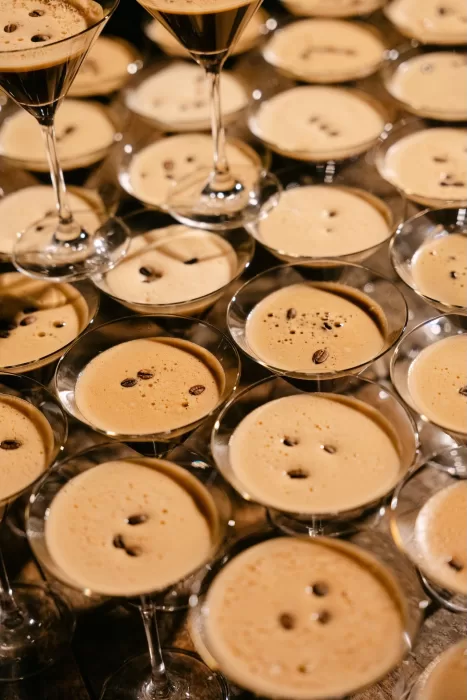 Rows of espresso martinis with coffee beans served during the wedding reception at Dimora Delle Balze.