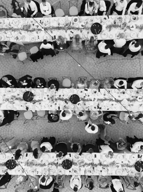 Overhead view of long banquet tables filled with guests enjoying dinner at Mas del Sord.