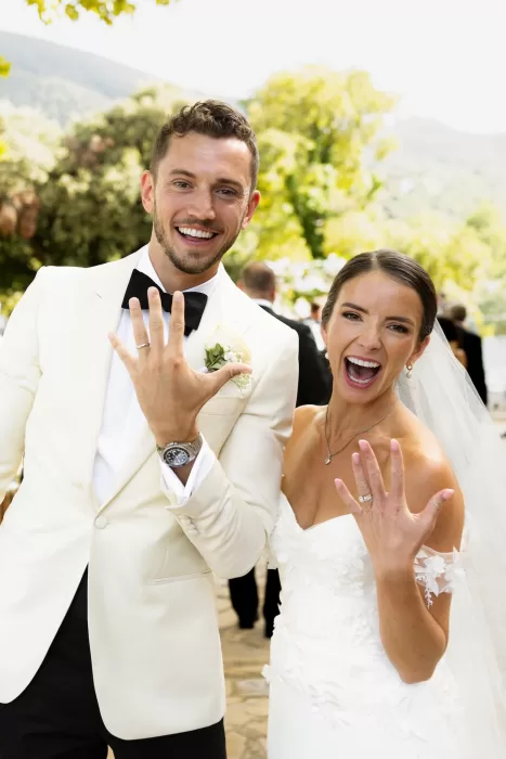 Newlyweds proudly showing their wedding rings moments after the ceremony at Mas del Sord.