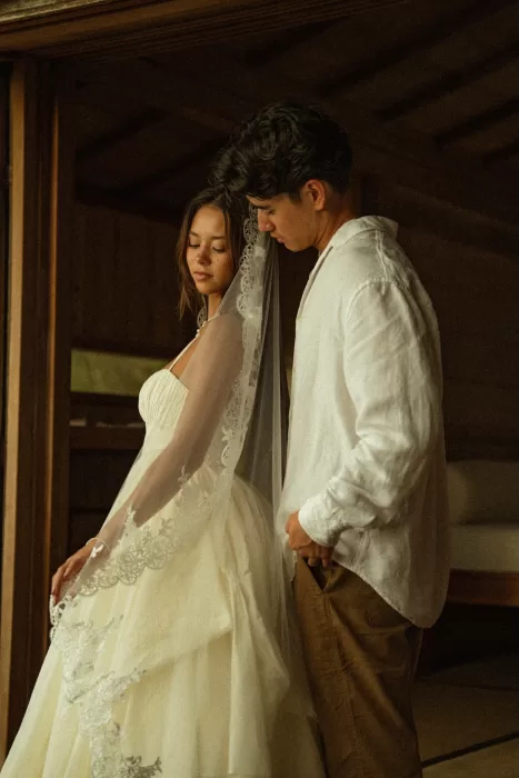 Intimate portrait of the couple inside the wooden interior of Ossipoff’s Cabin, captured in soft, natural light.