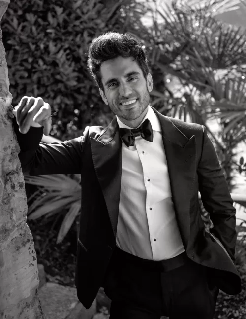 Black and white portrait of the groom in a tuxedo during the wedding at Villa Lario Resort