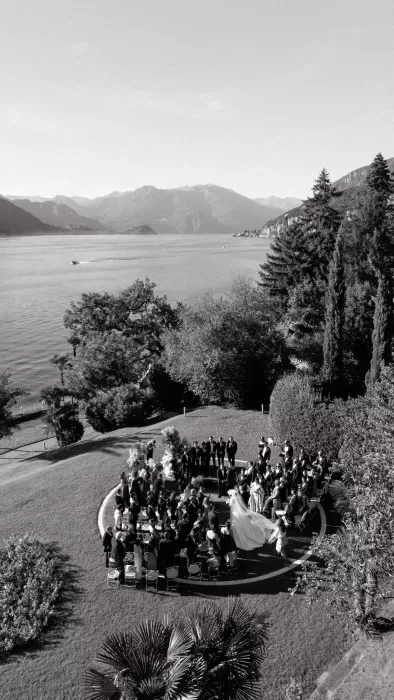 Aerial black and white view of a lakeside wedding ceremony at Villa Lario Resort