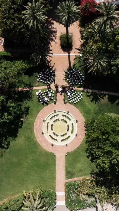 Aerial view of an outdoor wedding ceremony layout in the gardens of Finca La Concepción.
