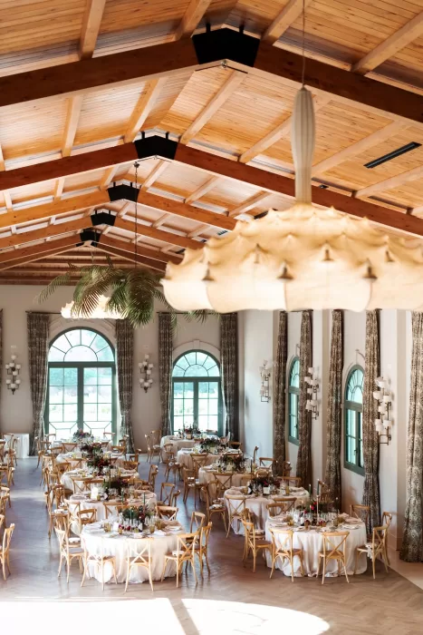 Wide view of the wedding reception set up inside Finca La Concepción, showcasing the spacious hall and refined décor.